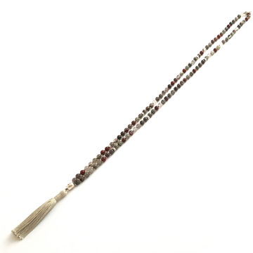 Handmade Empowering Mala Necklace – Bloodstone for Strength & Protection  laid on table